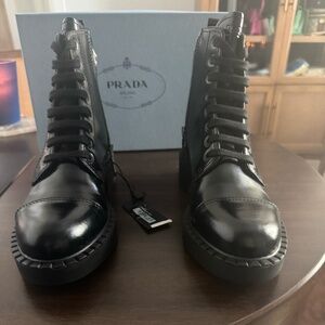 PRADA SPAZZOLATO LEATHER COMBAT BOOTS IN BLACK